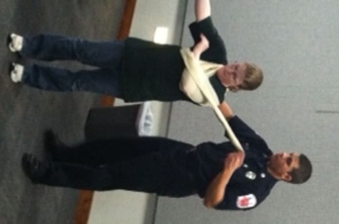 Teaching CERT civilian responders proper procedures for splinting/bandaging injuries in a disaster situation.